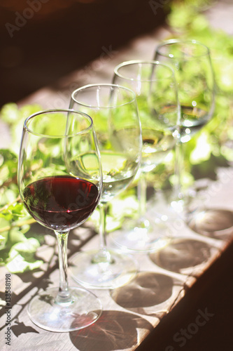 Wine glasses on on sunny outdoor table