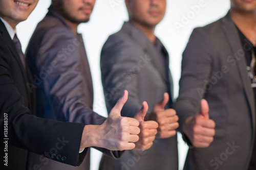 Fototapeta Naklejka Na Ścianę i Meble -  Hands of business people showing thumbs up