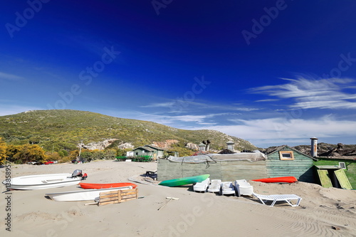 Boats and plastic loungers on the sand. Patara beach-Lycia-Turkey. 1400