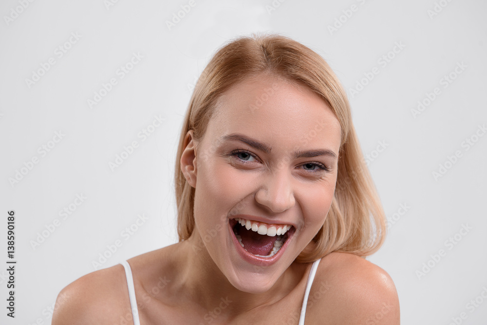 Happy young woman smiling with joy Happy young woman smiling with joy