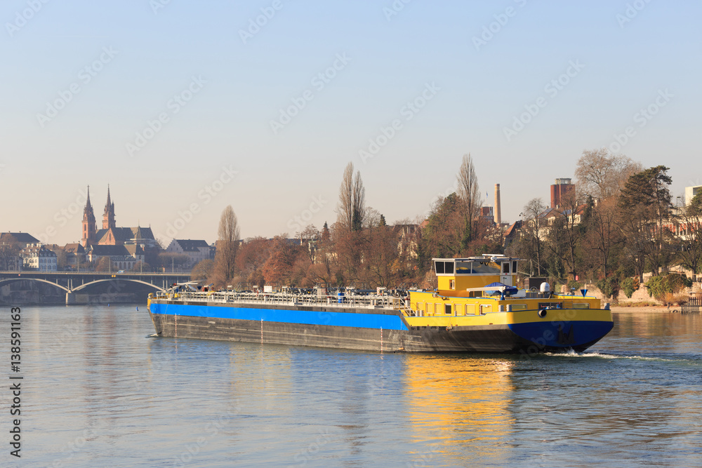 Naklejka premium An anonymous cargo ship on the Rhine in Basel
