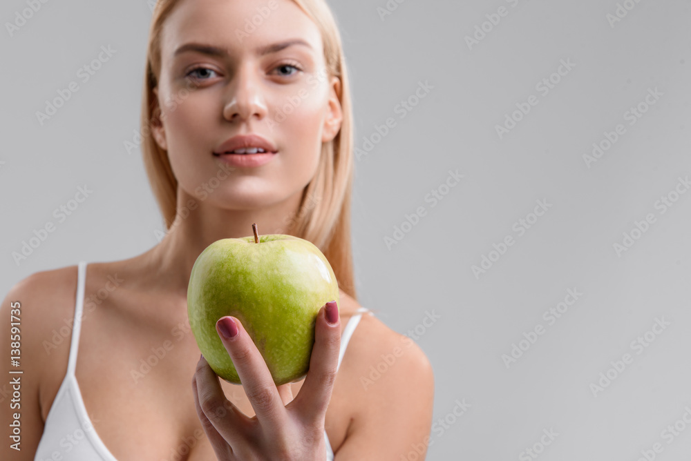 Voluptuous woman eating vitamins with pleasure Voluptuous woman eating vitamins with pleasure