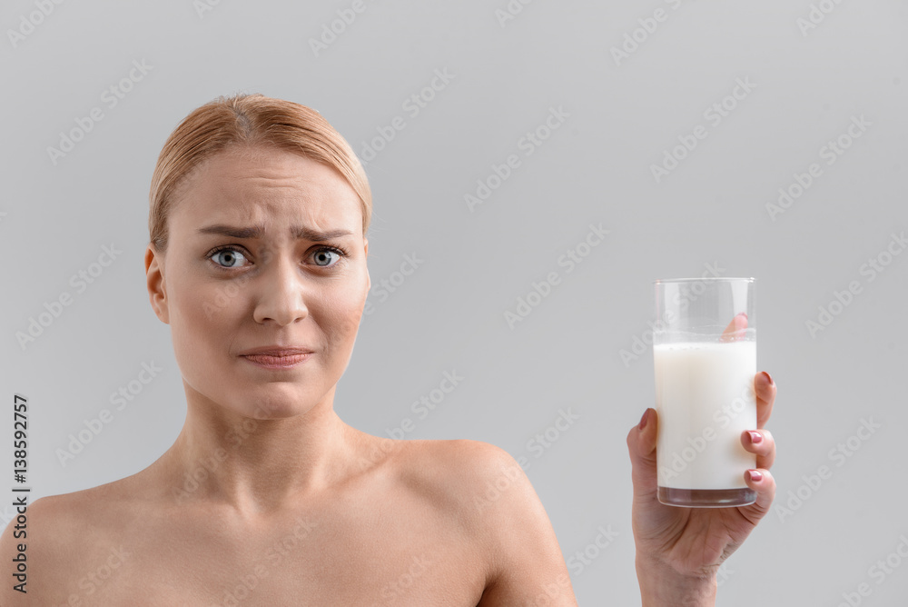 Young woman feels aversion about milk Young woman feels aversion about milk