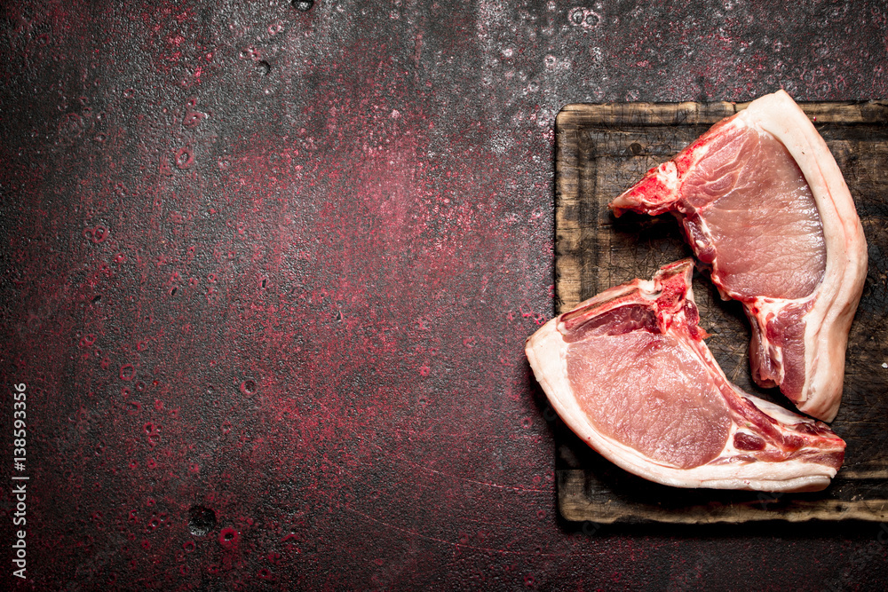 Raw meat background. Raw pieces of pork on the bone.