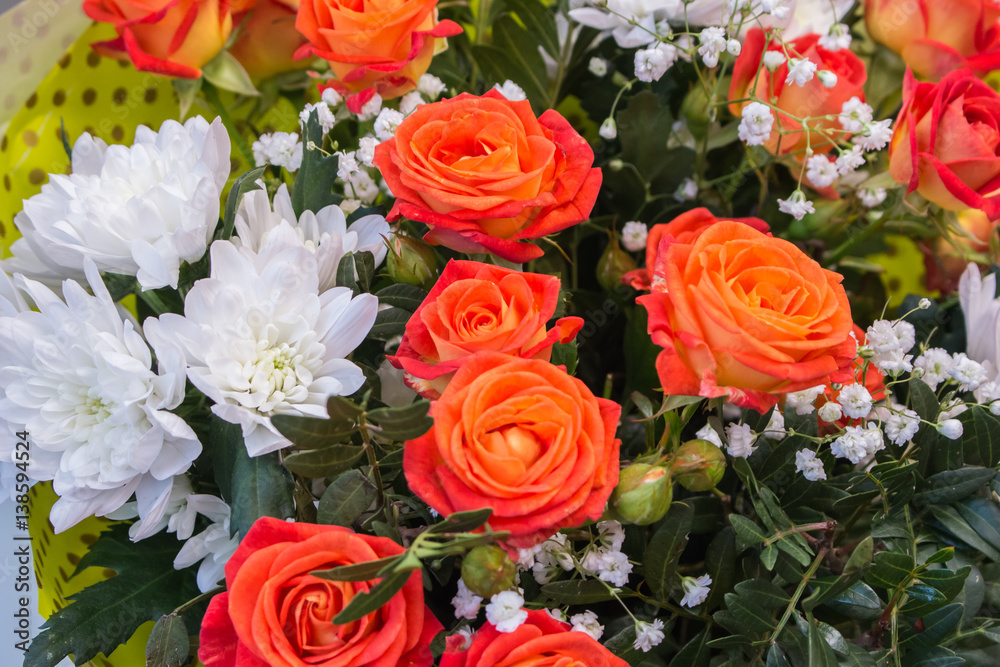 Bunch of big orange red tea roses and white chrysanthemum Bunch of big orange red tea roses and white chrysanthemum