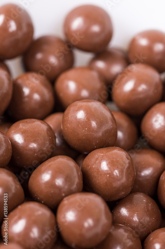 Chocolate round beads marbles sweet cookies macro closeup