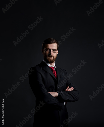 Businessman with beard. Black background with copyspace. Business and office concept.