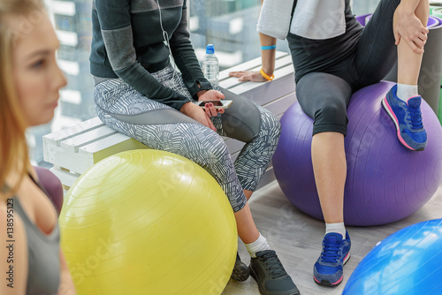 Sportive young woman in gym photo