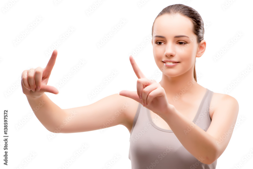 Young sports girl pressing virtual button isolated on white Young sports girl pressing virtual button isolated on white
