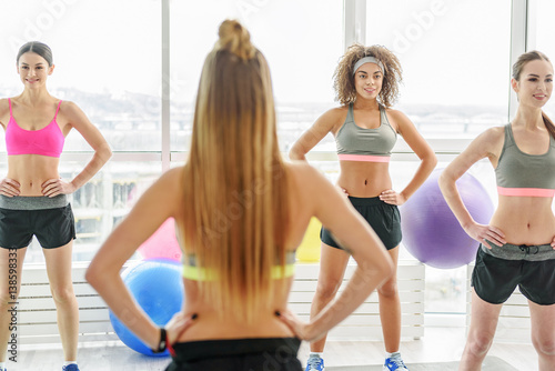 Hilarious young sportive women in gym