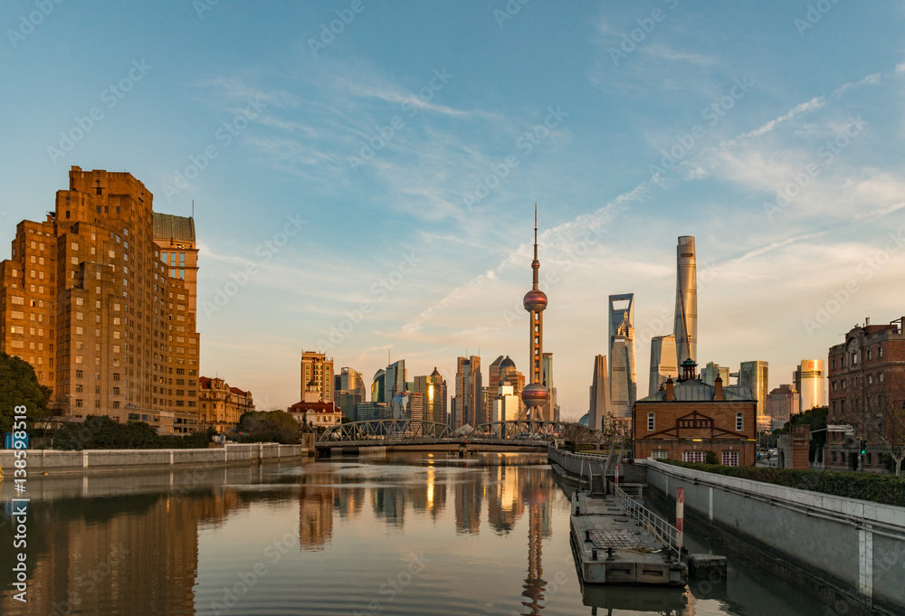 View of Pudong, Shanghai, China from the banks of the Wusong River at the golden hour

