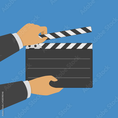 Black opened clapperboard in hands.