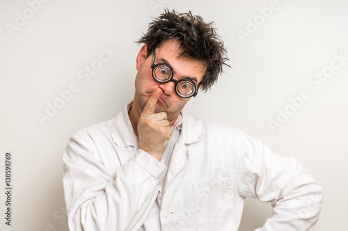 Crazy scientist thinking about his experiment