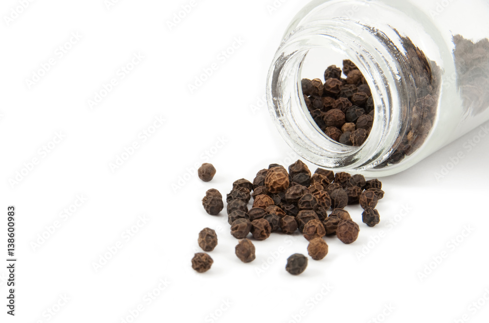Peppercorn near to a pepperbox Peppercorn near to a pepperbox