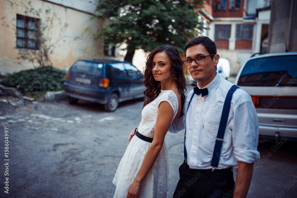 Young couple in love, hugging in the old part of town Young couple in love, hugging in the old part of town