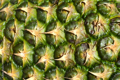 Pineapple fruit close-up. Texture of ananas pattern skin.