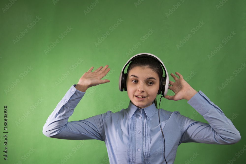 teen school girl listen music in headphones