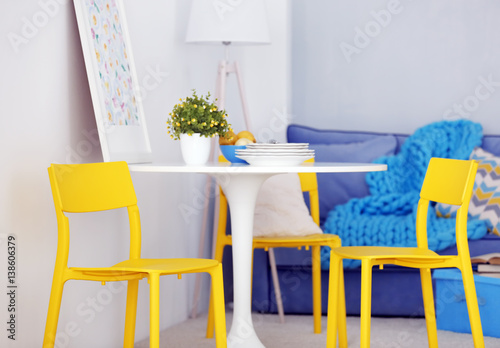 Modern room interior with yellow chairs © Africa Studio