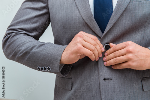 Businessman dressing up for work