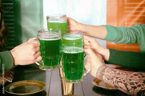Hands of people with beer c...
