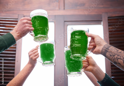 Hands of people with beer c...