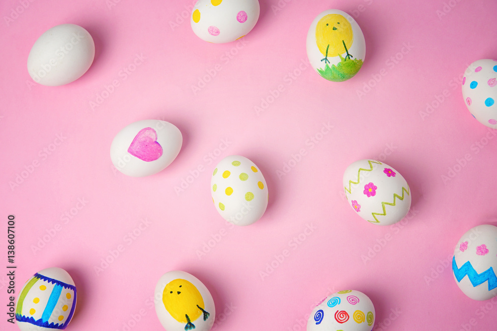 Painted Easter eggs on color background
