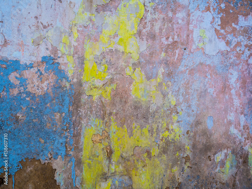 Textured old weathered wall with crumbling plaster