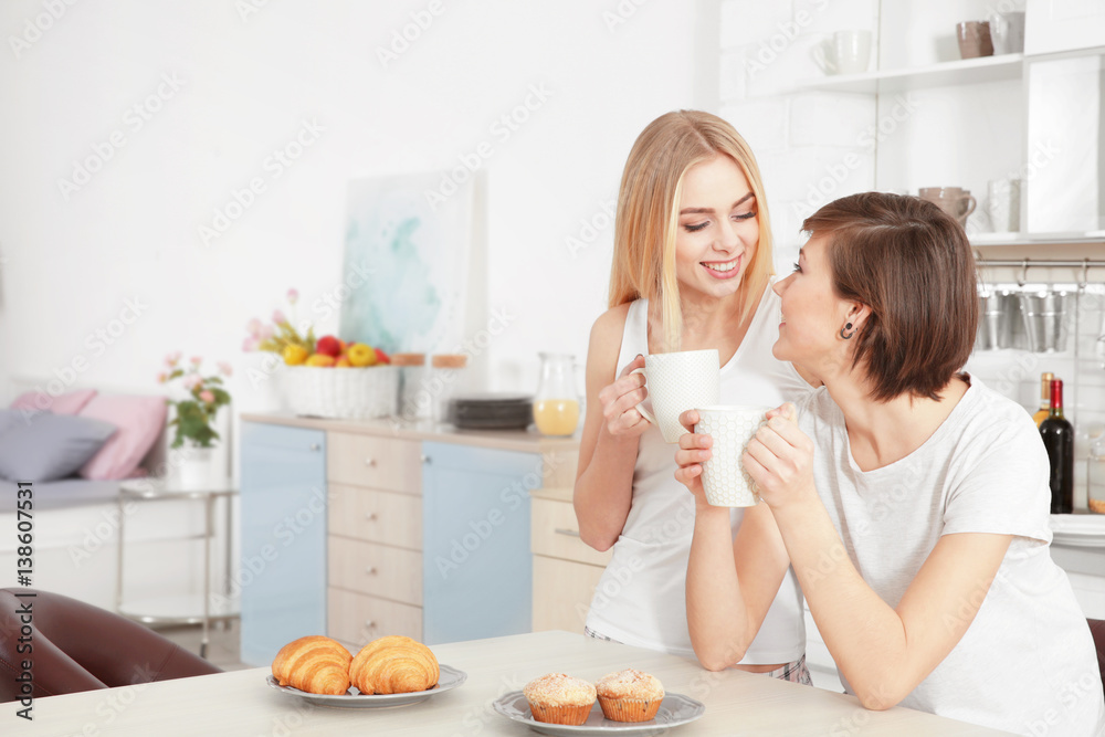 Morning of young lesbian couple at home Morning of young lesbian couple at home