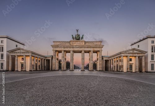 Colorful sunrise at the Brandenburg Gate in Berlin, Germany in February