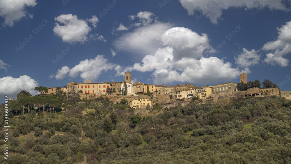 Beautiful panorama of the medieval village of Montepescali overlooking the whole hill and the forest below, Grosseto, Tuscany, Italy