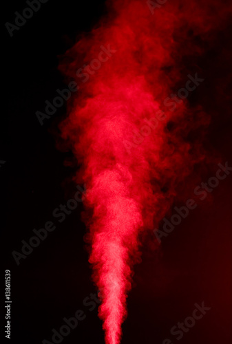 Red vapor on black background