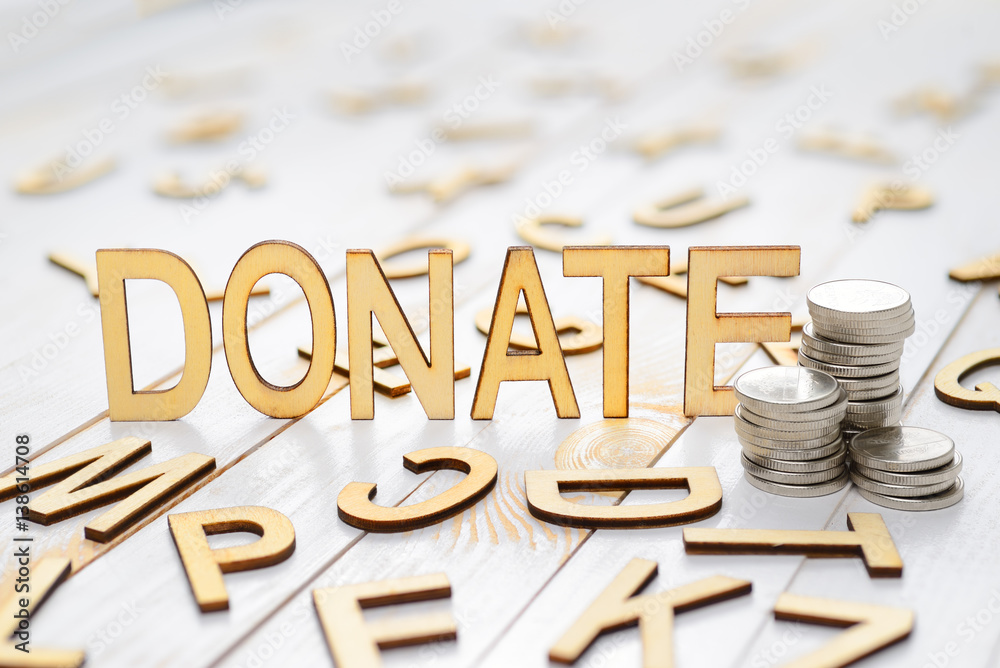 Wood word donate StockFoto Adobe Stock