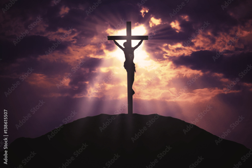 Naklejka premium Christian cross on hill at sunrise