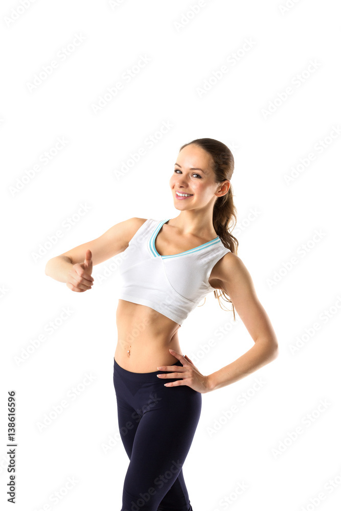 Sport girl with a thumbs up isolated on white background.