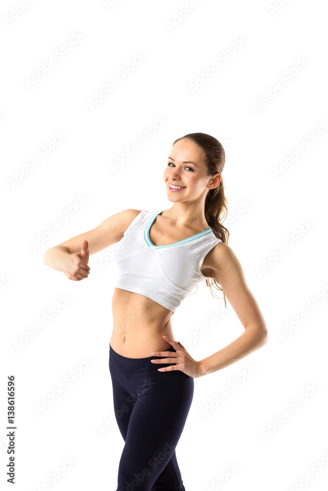 Sport girl with a thumbs up isolated on white background. Sport girl with a thumbs up isolated on white background.