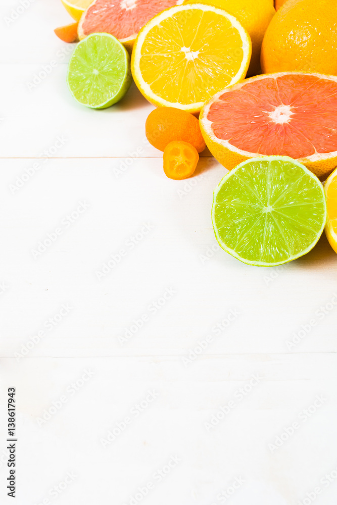 Citrus fruit on the white wooden background Citrus fruit on the white wooden background