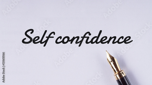 "Self confidence" words written on white paper using fountain pen - business and finance concept © noridzuan87