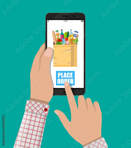 Hand and smartphone with shopping bag