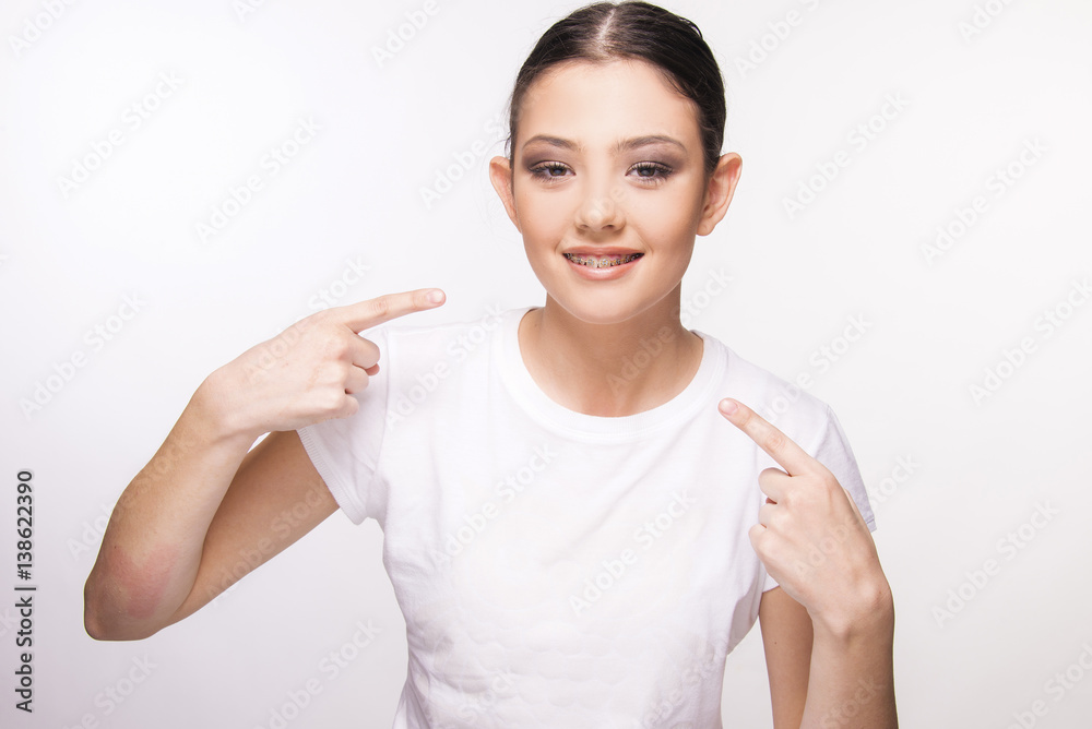 girl with brace smiling on white girl with brace smiling on white