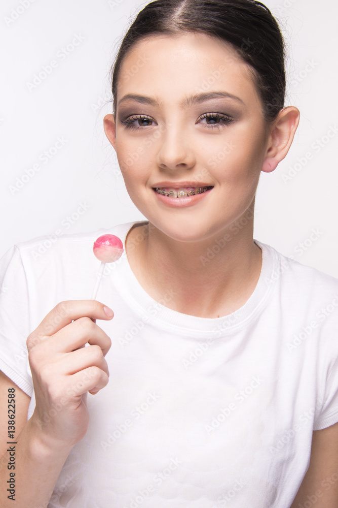 girl with brace smiling on white girl with brace smiling on white