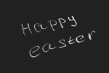 Chalkboard with the words Happy Easter.