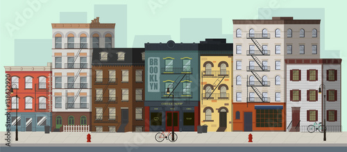 Fotografia Street landscape with apartment buildings, shops and bars