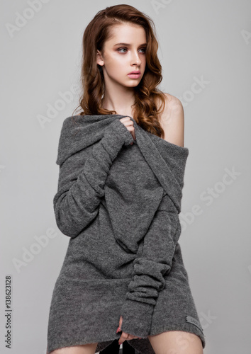 Young beautiful fashion model wearing knitwear jumper photo