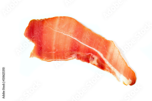 Prosciutto ham slice isolated on white