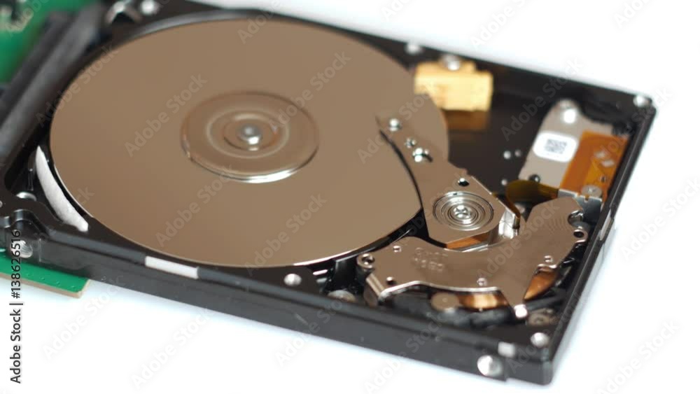 View of disassembled Hard Disk drive spin up and head movement. View of disassembled Hard Disk drive spin up and head movement.