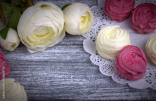 Wallpaper Mural White buttercup flowers ranunculus white and pink zephyr marshmallows lacy paper napkin on gray wooden background. Copy space. Torontodigital.ca