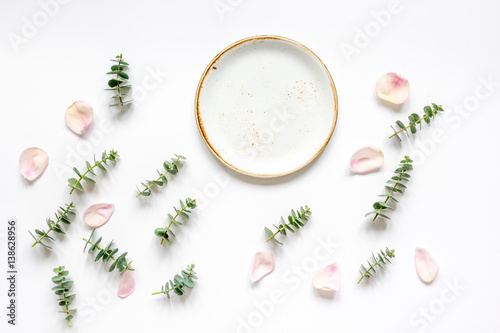 woman table with flower and herbs top view white background mock up