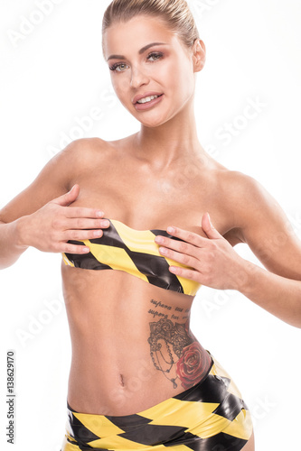 Woman in warning tape posing.