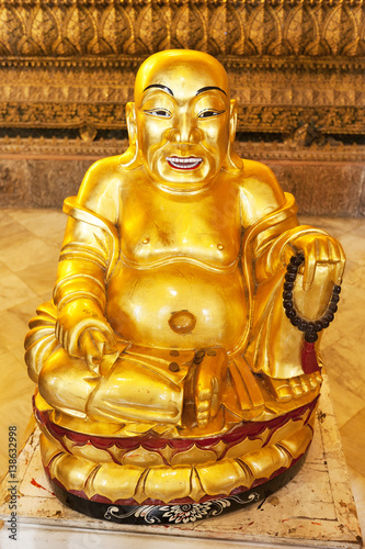 Gold statue of Budai the Fat Buddha or Smiling Buddha 