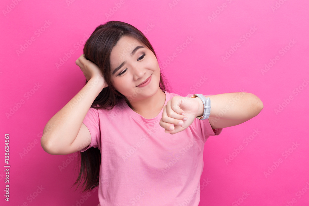 Shy woman check her watch she is late Shy woman check her watch she is late